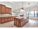 Gourmet kitchen features granite countertops, a large island, custom cabinetry, and stainless steel appliances at 2799 E Jade Pl, Chandler, AZ 85286