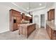 Beautiful kitchen features granite countertops, a large island, custom cabinetry, and stainless appliances at 2799 E Jade Pl, Chandler, AZ 85286