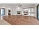 Open living space showcasing hardwood floors, a stone fireplace, and a modern entertainment center at 2799 E Jade Pl, Chandler, AZ 85286