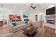 Spacious living room with a fireplace, hardwood floors, and an open floor plan at 2799 E Jade Pl, Chandler, AZ 85286