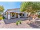 Backyard featuring a fountain, pavers, mature trees, and rock landscaping at 3020 E Tiffany Way, Gilbert, AZ 85298