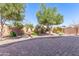 Paver patio and landscaping with mature trees and a fountain at 3020 E Tiffany Way, Gilbert, AZ 85298