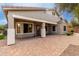 Covered patio with a brick paver patio and minimal landscaping at 3020 E Tiffany Way, Gilbert, AZ 85298