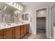 This primary bathroom features a dual sink vanity with a mirror and updated fixtures at 3020 E Tiffany Way, Gilbert, AZ 85298