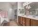 A spacious primary bathroom provides dual sinks, nice mirrors and plenty of counter space at 3020 E Tiffany Way, Gilbert, AZ 85298