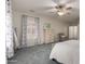 The primary bedroom has nice natural light, plush carpet, and a ceiling fan for added comfort at 3020 E Tiffany Way, Gilbert, AZ 85298