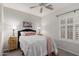 The bedroom is bright and cozy, featuring a ceiling fan, plush carpet, and plantation shutters at 3020 E Tiffany Way, Gilbert, AZ 85298