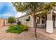 Exterior view of home with green awnings, landscaping, and paver patio at 3020 E Tiffany Way, Gilbert, AZ 85298