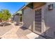 Side yard view of a home exterior featuring a door and window with green awnings at 3020 E Tiffany Way, Gilbert, AZ 85298