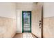 A bright foyer welcomes you with natural light, an open door, and neutral walls at 3020 E Tiffany Way, Gilbert, AZ 85298