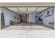 Spacious garage with epoxy flooring, cabinets, and a water heater at 3020 E Tiffany Way, Gilbert, AZ 85298