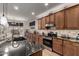 Modern kitchen with granite counters, tiled backsplash, and stainless steel appliances at 3020 E Tiffany Way, Gilbert, AZ 85298