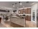 Gourmet kitchen featuring granite counters, stainless steel appliances, and a functional island at 3020 E Tiffany Way, Gilbert, AZ 85298