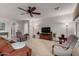 Bright living room featuring neutral paint, ceiling fan, and comfortable seating arrangement at 3020 E Tiffany Way, Gilbert, AZ 85298