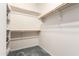 This walk-in closet features built-in shelving and plenty of hanging space for organization at 3020 E Tiffany Way, Gilbert, AZ 85298