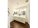 Bathroom with double vanity, framed mirrors, and plenty of cabinet storage at 357 E Las Puertas Ln, Queen Creek, AZ 85140