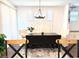 Dining area showcasing a large table, comfortable seating, and stylish lighting for a warm atmosphere at 357 E Las Puertas Ln, Queen Creek, AZ 85140