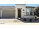 Inviting single-story home with a charming exterior and well-maintained landscaping and a two car garage at 357 E Las Puertas Ln, Queen Creek, AZ 85140