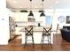 Open kitchen and living area featuring an island with bar stools, and stainless steel appliances at 357 E Las Puertas Ln, Queen Creek, AZ 85140