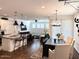 Open concept living space with kitchen, dining area, and living room with ample natural light at 357 E Las Puertas Ln, Queen Creek, AZ 85140
