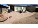 Spacious paved backyard patio with outdoor seating, perfect for entertaining or relaxing at 357 E Las Puertas Ln, Queen Creek, AZ 85140