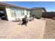 Outdoor patio with comfortable seating, ideal for enjoying the serene backyard and sunny weather at 357 E Las Puertas Ln, Queen Creek, AZ 85140