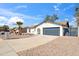 A well-maintained home exterior with desert landscaping, garage, and unique architectural details at 3906 W Pershing Ave, Phoenix, AZ 85029