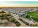 Expansive community view with a walking trail, green spaces, and beautiful homes, perfect for families at 4247 E Tonto Pl, Chandler, AZ 85249