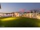 Expansive backyard with lush green lawn, a covered bar, and a sparkling pool, perfect for outdoor enjoyment at 4247 E Tonto Pl, Chandler, AZ 85249
