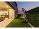 This manicured backyard offers artificial turf and a privacy hedge at 4247 E Tonto Pl, Chandler, AZ 85249