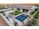 Captivating backyard featuring a pool, outdoor kitchen with pergola, and a covered patio for relaxation at 4247 E Tonto Pl, Chandler, AZ 85249