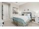 This is a cozy bedroom with art, fresh carpet, and natural light at 4247 E Tonto Pl, Chandler, AZ 85249
