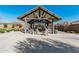 Relaxing community gazebo area with cozy seating and a beautiful outdoor fireplace feature at 4247 E Tonto Pl, Chandler, AZ 85249