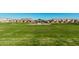 Expansive community lawn area with a gazebo and well-maintained landscaping in a residential neighborhood at 4247 E Tonto Pl, Chandler, AZ 85249