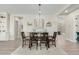 Charming dining room with stylish chandelier, seating for six, and neutral decor at 4247 E Tonto Pl, Chandler, AZ 85249