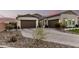 Beautiful exterior showing the brick driveway of this home and desert landscaping at 4247 E Tonto Pl, Chandler, AZ 85249