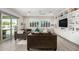 Living area with a large sofa and built in shelving with a view of the backyard at 4247 E Tonto Pl, Chandler, AZ 85249