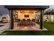 Stylish outdoor bar area with pendant lighting and comfortable seating; an ideal space for entertaining guests at 4247 E Tonto Pl, Chandler, AZ 85249