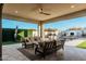 Inviting patio with comfortable seating, offering a seamless transition to the outdoor pool and fireplace area at 4247 E Tonto Pl, Chandler, AZ 85249