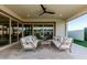 Inviting outdoor patio with comfortable seating and a ceiling fan, ideal for enjoying warm weather and relaxation at 4247 E Tonto Pl, Chandler, AZ 85249