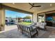 Spacious patio with an open design, featuring a comfortable seating area and views of the pool, bar, and fireplace at 4247 E Tonto Pl, Chandler, AZ 85249