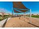 Playground featuring modern shade structure, climbing features, and swing sets at 4247 E Tonto Pl, Chandler, AZ 85249