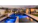 Enjoy a backyard retreat with a sparkling pool, spa, fireplace, and outdoor kitchen at 4247 E Tonto Pl, Chandler, AZ 85249