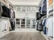 Organized walk-in closet featuring custom storage solutions and ample hanging space at 4247 E Tonto Pl, Chandler, AZ 85249