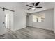 Bedroom featuring a ceiling fan with access to two other rooms at 5209 W Hatcher Rd, Glendale, AZ 85302