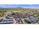 Aerial view of the community center featuring tennis courts, putting green, large parking lot, and clubhouse at 5405 S Marigold Way, Gilbert, AZ 85298