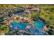 Aerial view of the community center featuring a large pool, clubhouse, and manicured landscaping at 5405 S Marigold Way, Gilbert, AZ 85298