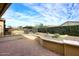 Charming backyard with a red brick patio, privacy hedge, and a beautifully landscaped desert landscape at 5405 S Marigold Way, Gilbert, AZ 85298