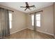 Bright bedroom with wood floors, ceiling fan, and good natural light at 5405 S Marigold Way, Gilbert, AZ 85298