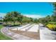 Community bocce ball court surrounded by mature landscaping and walking paths at 5405 S Marigold Way, Gilbert, AZ 85298